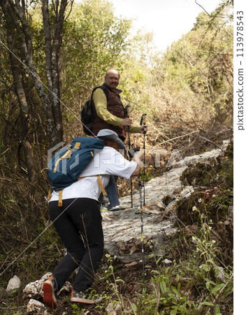 senior friends tourists outdoor adventure together on mediterranian sea landscape senior friends tourists outdoor adventure together on mediterranian sea landscape 113978543