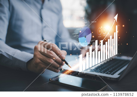 Businessman interacting with laptops, phones, and tablets with featuring stock tickers or graphs, cryptocurrency and new trading platforms, ideas and perspectives, Stock investment,New technology 113978652