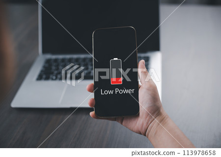 Close up man's hands using smart phone battery low charge battery screen, Businessman holding a smartphone Low battery warning on a mobile phone. Need to connect the charger to the smartphone icon Close up man's hands using smart phone battery low charge battery screen, Businessman holding a smartphone Low battery warning on a mobile phone. Need to connect the charger to the smartphone icon 113978658