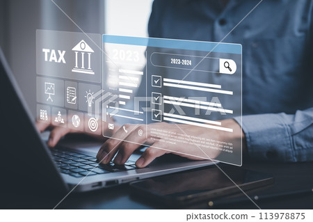 Hand using tablet with bar  TAX REFUND and refund tax of duty taxation business, graphs and chart being demonstrated on the screen media,  tablet pc and selecting tax refund. 113978875