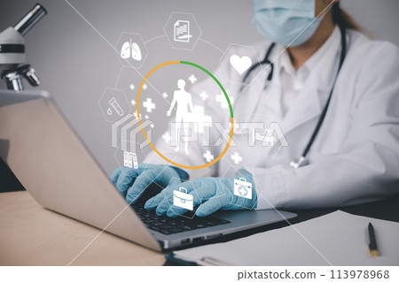 Medical doctor and medical technology and futuristic concept, Doctor using laptop and health medical network connection icon on virtual screen interface, Modern medical technology and innovation. 113978968