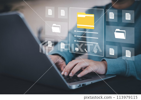 Businesswoman working on laptop with virtual screen. Online documentation database, IT consultant being set up Virtual Document Management System with a laptop, Software for archiving corporate files. 113979115