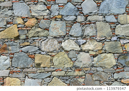 Very old gray natural stone wall Very old gray natural stone wall 113979347