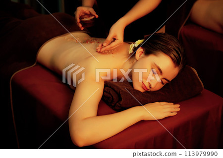Woman customer having exfoliation treatment in luxury spa. Quiescent 113979990