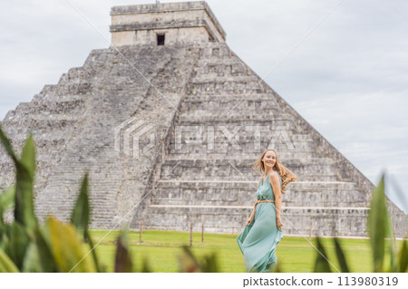 Beautiful tourist woman observing the old pyramid and temple of the castle of the Mayan architecture known as Chichen Itza these are the ruins of this ancient pre-columbian civilization and part of Beautiful tourist woman observing the old pyramid and temple of the castle of the Mayan architecture known as Chichen Itza these are the ruins of this ancient pre-columbian civilization and part of 113980319