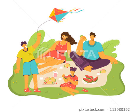 Family enjoying picnic green grass, children parents eating, flying kite. Young boy flies colorful kite, parents young girl sit around foodladen blanket, happy leisure activity outdoors. Casual 113980392