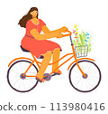 Woman cycling leisurely, enjoying sunny day. Female cyclist wears casual dress, rides orange bike, carries flowers basket. Smiling lady curly hair, glasses pedals through leisure scene 113980416