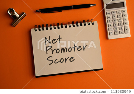 There is a notebook with the words "Net Promoter Score" written on it. There is a notebook with the words "Net Promoter Score" written on it. 113980949