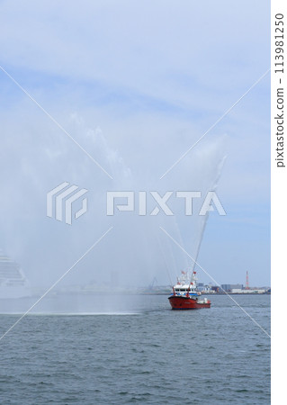 Fireboat spraying water Fireboat spraying water 113981250