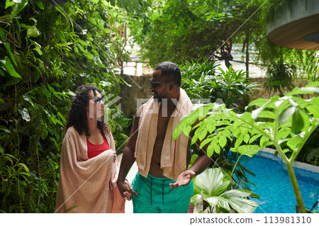 Young couple chatting after swimming Young couple chatting after swimming 113981310