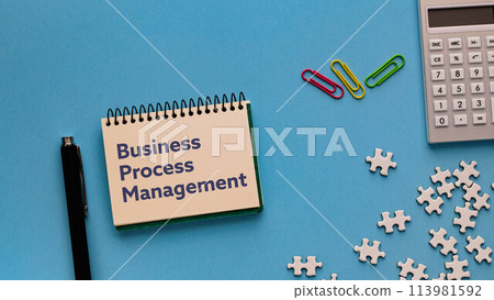 There is a notebook with the words Business Process Management written on it. There is a notebook with the words Business Process Management written on it. 113981592