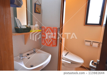 A warm, homely bathroom with a simple and functional wash space A warm, homely bathroom with a simple and functional wash space 113981644