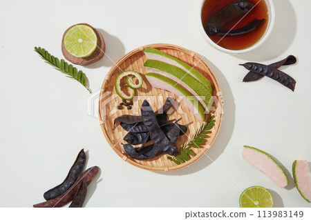 In the center of picture, a rattan tray with a few ingredients for product extract from black locust displayed, black locust can help prevent hair loss. Blank space for displaying or presentation In the center of picture, a rattan tray with a few ingredients for product extract from black locust displayed, black locust can help prevent hair loss. Blank space for displaying or presentation 113983149