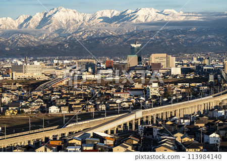 View of the Tateyama mountain range and the Hokuriku Shinkansen from Mount Kureha 113984140