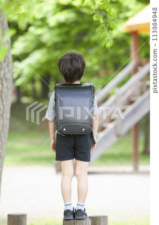 First graders carrying their school bags First graders carrying their school bags 113984948