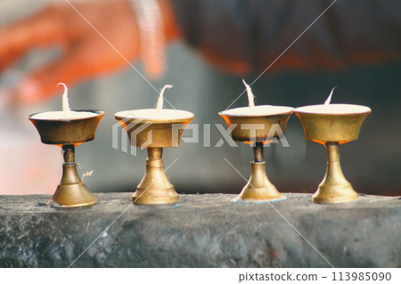 Brass tibetan ghee lamps or butter lamps, symbolizing spirituality and used in sacred Buddhist rituals 113985090