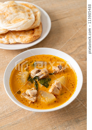 Chicken curry soup with roti Chicken curry soup with roti 113985488
