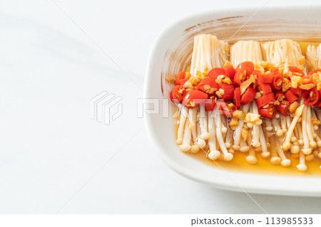 steamed golden needle mushroom or enokitake with soy sauce, chilli and garlic steamed golden needle mushroom or enokitake with soy sauce, chilli and garlic 113985533