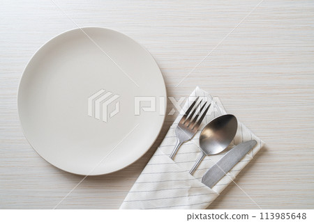 empty plate or dish with knife, fork and spoon 113985648