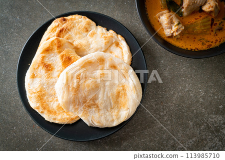 Chicken curry soup with roti Chicken curry soup with roti 113985710