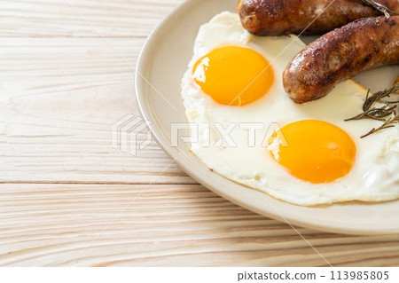 double fried egg with pork sausage 113985805
