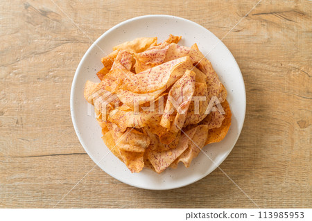 Taro Chips - fried or baked sliced taro 113985953