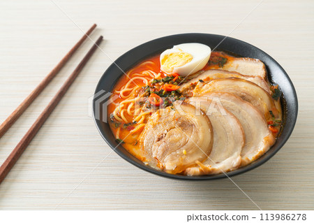 Ramen Noodles Spicy Tomyum Soup with Roast Pork Ramen Noodles Spicy Tomyum Soup with Roast Pork 113986278