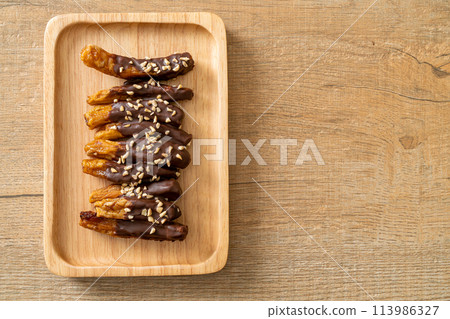 banana chocolate coating or banana dipped chocolate banana chocolate coating or banana dipped chocolate 113986327
