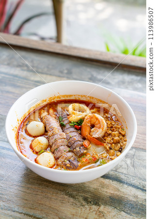 spicy seafood noodles bowl in Thai style spicy seafood noodles bowl in Thai style 113986507