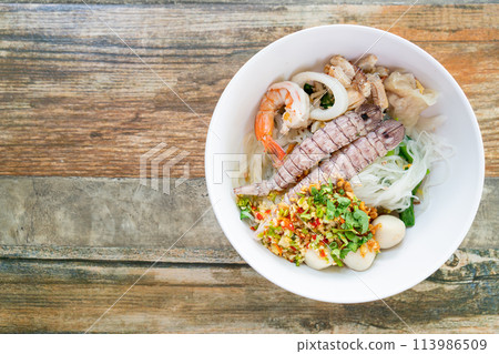 spicy seafood noodles bowl in Thai style spicy seafood noodles bowl in Thai style 113986509