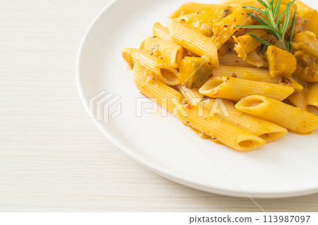 pumpkin penne pasta alfredo sauce 113987097