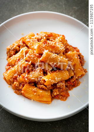 Rigatoni pasta bolognese with cheese 113987195