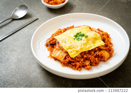 kimchi fried rice with pork and topped cheese kimchi fried rice with pork and topped cheese 113987222