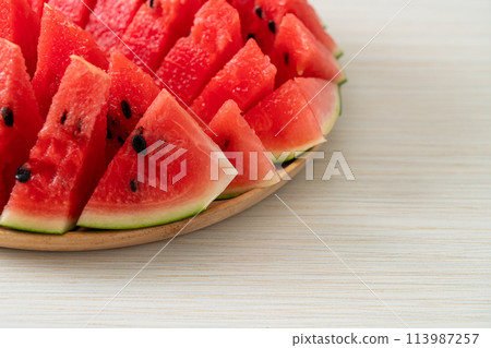fresh watermelon sliced on plate 113987257