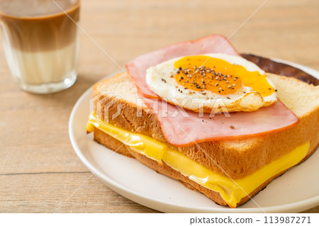 bread toasted cheese topped ham and fried egg with pork sausage bread toasted cheese topped ham and fried egg with pork sausage 113987271