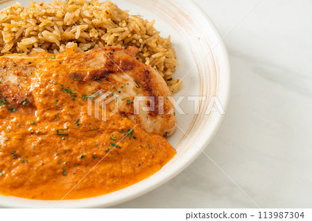 grilled chicken steak with red curry sauce and rice 113987304