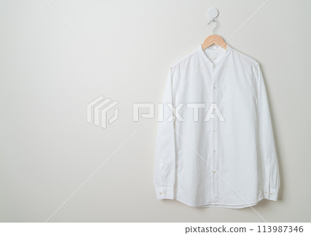hanging shirt with wood hanger on wall hanging shirt with wood hanger on wall 113987346