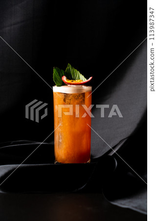cocktail - infused tequila with basil, passion fruit and cinnamon, lime and mango 113987347