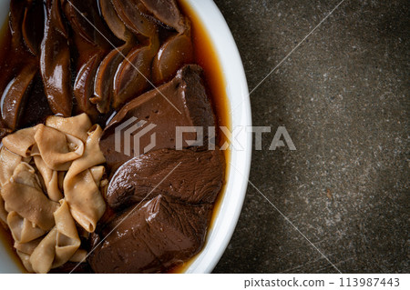 stewed duck offal in brown soup 113987443