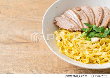 dried duck noodles in white bowl 113987453