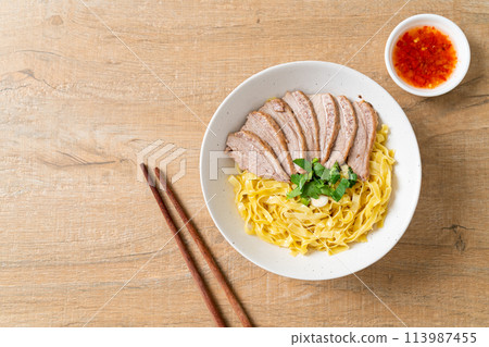 dried duck noodles in white bowl 113987455