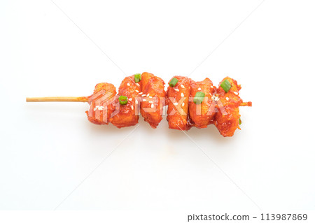 deep fried Korean rice cake (Tteokbokki) skewered with spicy sauce 113987869