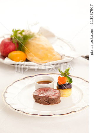 Main beef steak of the French course, fashionable presentation stock image Main beef steak of the French course, fashionable presentation stock image 113987907