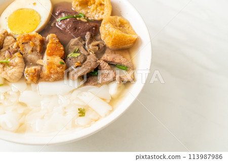 paste of rice flour or boiled Chinese pasta square in clear soup 113987986