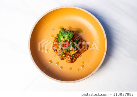 spicy grilled pork larb salad 113987992