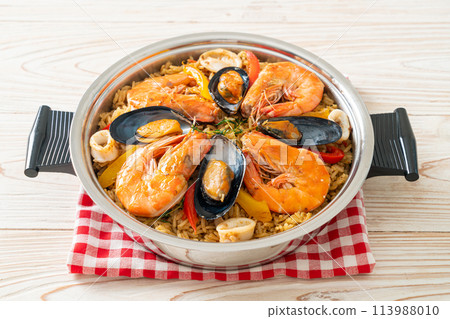 Seafood Paella with prawns, clams, mussels on saffron rice Seafood Paella with prawns, clams, mussels on saffron rice 113988010