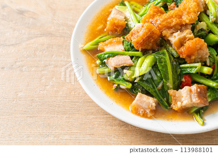Stir-fried kale vegetable with crispy pork Stir-fried kale vegetable with crispy pork 113988101
