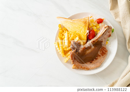 pork chop steak with chips and mini salad pork chop steak with chips and mini salad 113988122