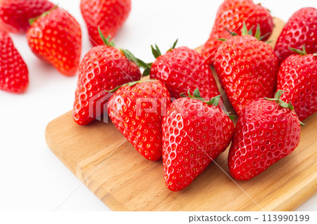 Large strawberries on a white background 113990199