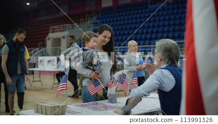 Female American citizen comes to vote in polling station Female American citizen comes to vote in polling station 113991326